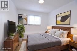 Bedroom staged featuring a textured ceiling - 