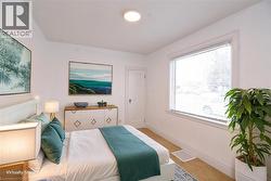 Bedroom staged with baseboards and carpet flooring - 