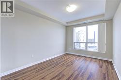Empty room with wood finished floors and baseboards - 