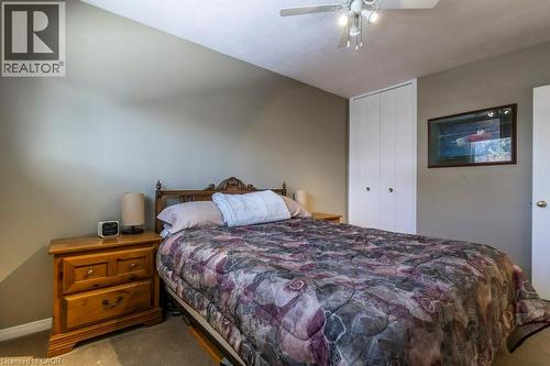 Bedroom featuring carpet floors, a closet, and a ceiling fan - 22 Redwing Road, Hamilton, ON - Indoor Photo Showing Bedroom