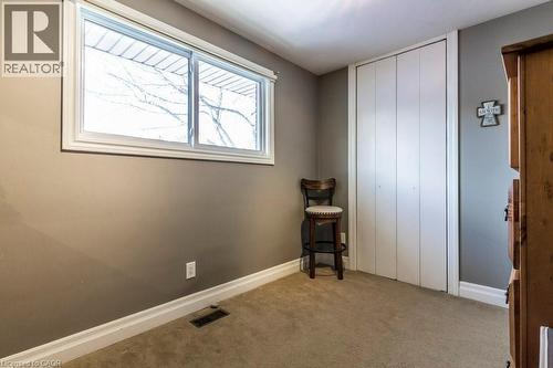 Carpeted bedroom featuring baseboards and a closet - 22 Redwing Road, Hamilton, ON - Indoor