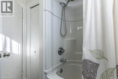 Full bathroom with shower / bath combination with curtain and a closet - 22 Redwing Road, Hamilton, ON - Indoor Photo Showing Bathroom