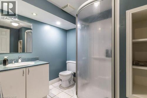 Bathroom featuring vanity, light tile patterned floors, a shower and recessed lighting - 22 Redwing Road, Hamilton, ON - Indoor Photo Showing Bathroom
