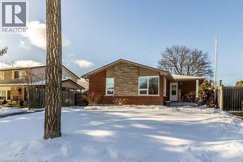 View of front of home featuring covered porch, stone siding, and brick siding - 22 Redwing Road, Hamilton, ON - Outdoor