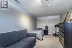 Bedroom with light carpet and baseboards - 