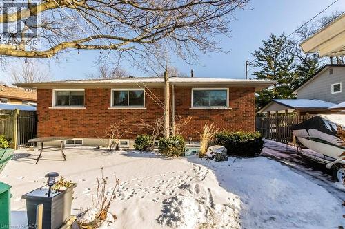 Back of house featuring brick siding, patio area - 22 Redwing Road, Hamilton, ON - Outdoor