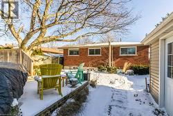 Snow covered patio featuring a patio area - 