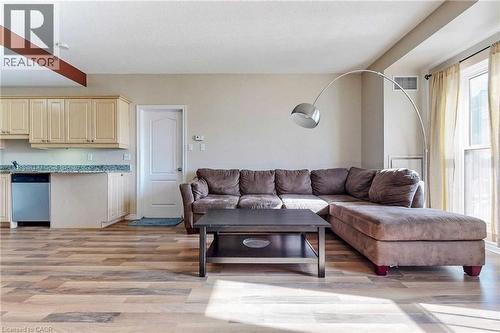 Living room with light hardwood / wood-style floors - 135 James Street Unit# 608, Hamilton, ON - Indoor Photo Showing Living Room