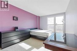 Carpeted bedroom with a textured ceiling - 