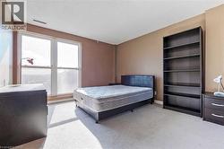 Carpeted bedroom with a textured ceiling - 