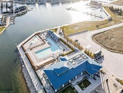 Bird's eye view of numerous boat docks and a large body of water - 