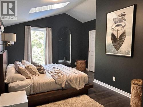 walk in closet, great view of back yard - 657 Windham Road 14, Simcoe, ON - Indoor Photo Showing Bedroom