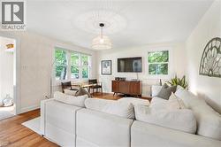 Living room with wood finished floors and baseboards - 