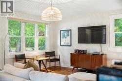 Living area featuring wood finished floors and baseboards - 