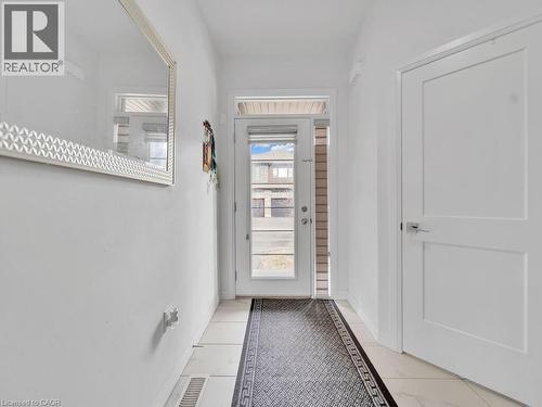 Doorway with tile patterned floors and baseboards - 30 Times Square Boulevard, Hamilton, ON - Indoor Photo Showing Other Room