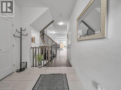 Hallway with stairway and baseboards - 30 Times Square Boulevard, Hamilton, ON - Indoor Photo Showing Other Room