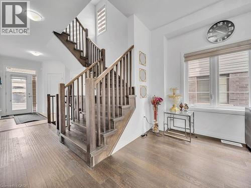 Staircase with wood-type flooring and baseboards - 30 Times Square Boulevard, Hamilton, ON - Indoor Photo Showing Other Room