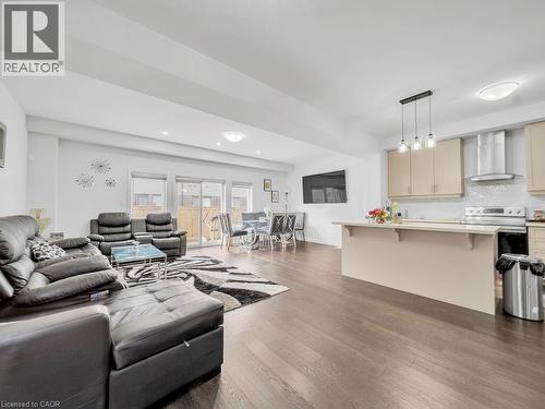 Living room featuring dark wood-style floors - 30 Times Square Boulevard, Hamilton, ON - Indoor