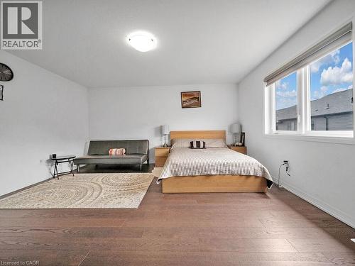 Bedroom with hardwood / wood-style flooring and baseboards - 30 Times Square Boulevard, Hamilton, ON - Indoor Photo Showing Bedroom