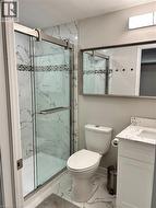 Full bath with marble finish flooring, vanity, and a marble finish shower - 