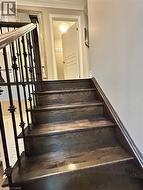 Stairway featuring crown molding - 