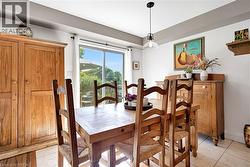 Dining room with light tile patterned floors - 