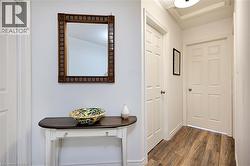 Hall with dark wood-style flooring - 