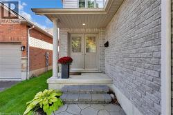 Doorway to property featuring brick siding - 