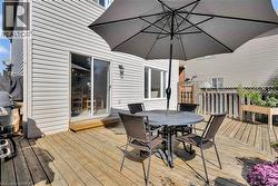 Wooden terrace featuring outdoor dining space - 