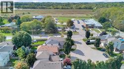 Aerial view of property's location with nearby suburban area - 