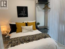 Double bed shown, however a Queen-sized Bed will fit. (previously staged) - 