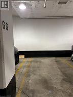 Well lit parking spot abuts wall - 