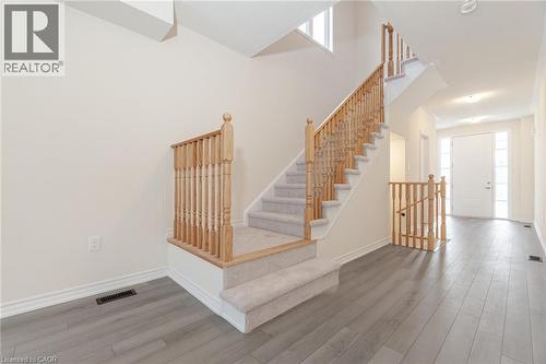 Stairway featuring hardwood / wood-style floors - 109 Molozzi Street, Erin, ON - Indoor Photo Showing Other Room