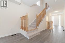 Stairway featuring hardwood / wood-style floors - 