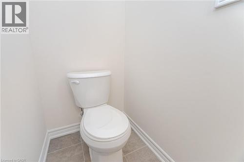 Bathroom featuring tile patterned floors and toilet - 109 Molozzi Street, Erin, ON - Indoor Photo Showing Bathroom
