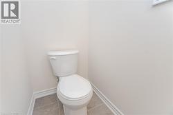 Bathroom featuring tile patterned floors and toilet - 