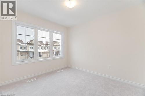 Unfurnished room featuring carpet flooring - 109 Molozzi Street, Erin, ON - Indoor Photo Showing Other Room