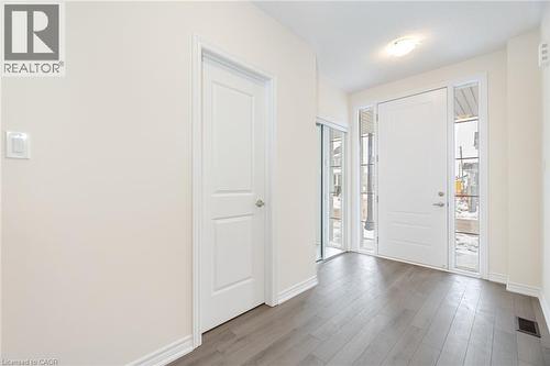Foyer entrance with light hardwood / wood-style floors - 109 Molozzi Street, Erin, ON - Indoor Photo Showing Other Room