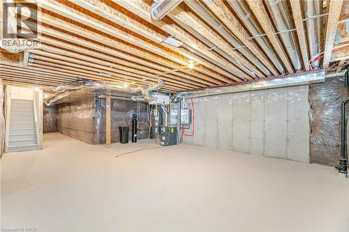 Basement featuring heating unit - 109 Molozzi Street, Erin, ON - Indoor Photo Showing Basement