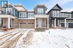 View of front of house with a balcony and a garage - 