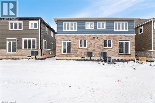 Snow covered back of property featuring central air condition unit - 109 Molozzi Street, Erin, ON - Outdoor