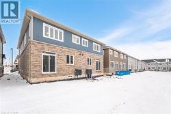 Snow covered house with central air condition unit - 
