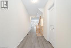 Hall featuring light hardwood / wood-style floors - 