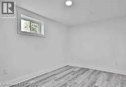 Bedroom 1 with light wood finished floors - 