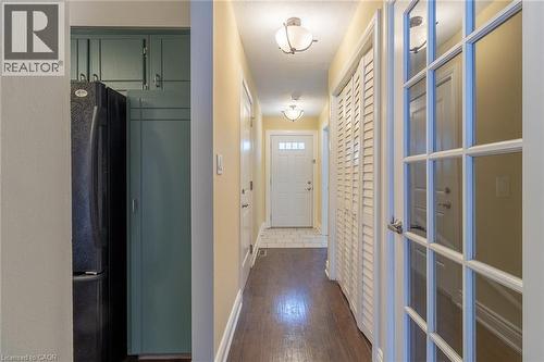 Hall featuring baseboards and dark wood finished floors - 58 Romy Crescent, Thorold, ON - Indoor Photo Showing Other Room