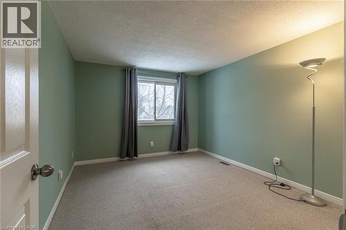 Unfurnished room with carpet flooring and a textured ceiling - 58 Romy Crescent, Thorold, ON - Indoor Photo Showing Other Room