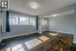 Spare room featuring baseboards and a textured ceiling - 