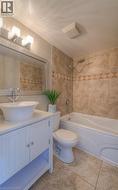 Bathroom featuring vanity and shower / bathtub combination - 