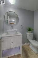 Bathroom featuring vanity and toilet - 