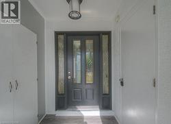 Doorway to property with stucco siding - 